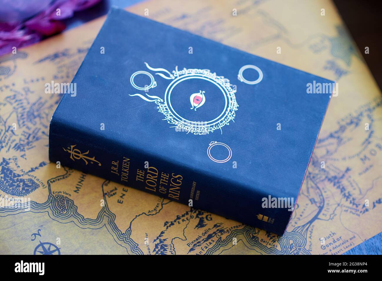 Black thick Lord of the Rings book lies on Middle-Earth map Stock Photo