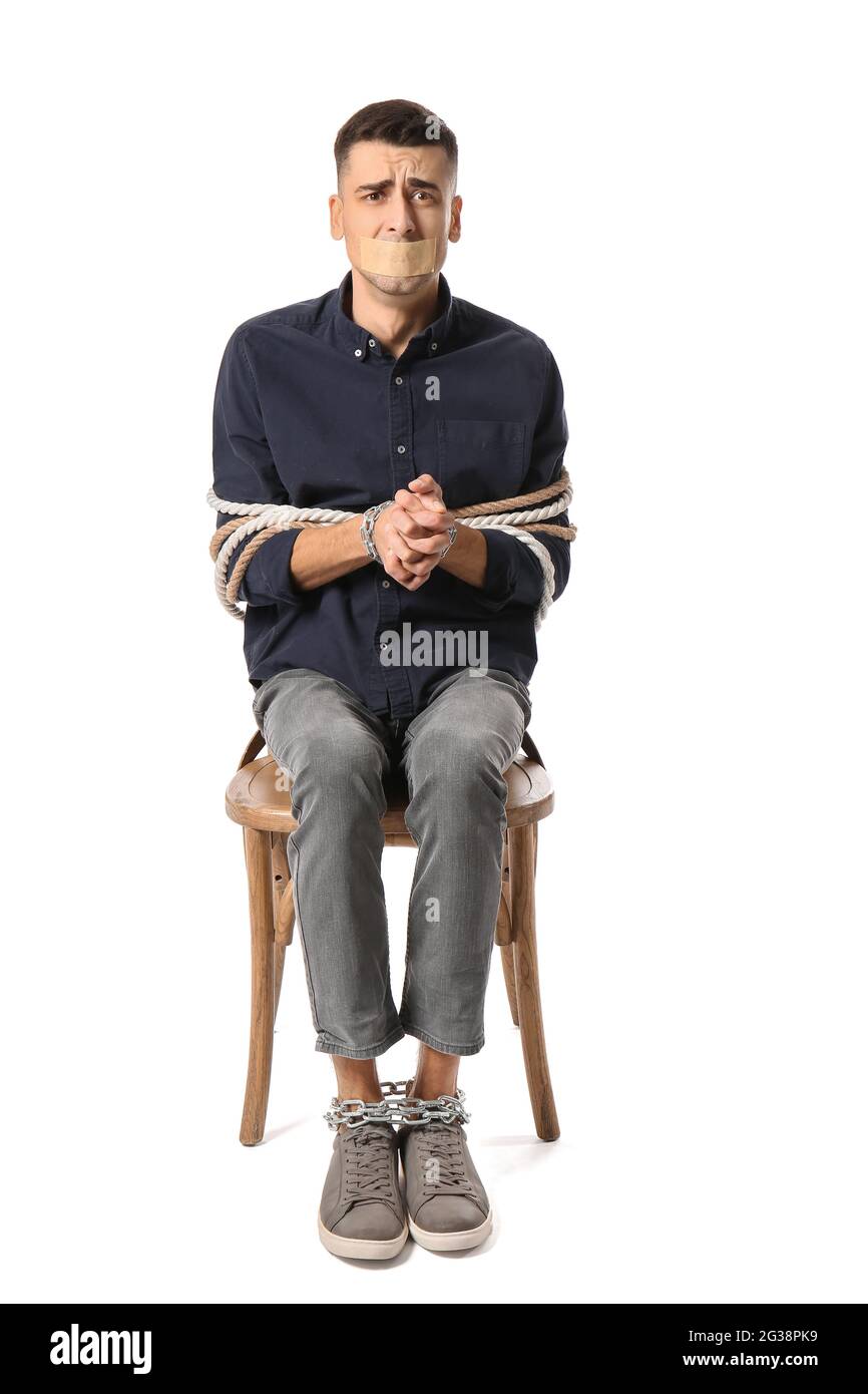 Male hostage on white background Stock Photo - Alamy