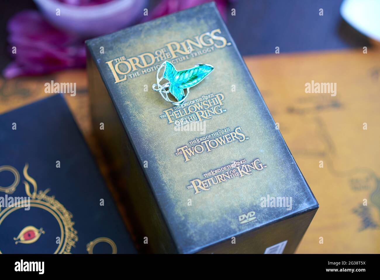 Astrakhan, Russia - 05.12.2021: Elven Lorien brooch lies on Lord of the Rings Trilogy Special Extended Edition 12-DVD Box Set Stock Photo
