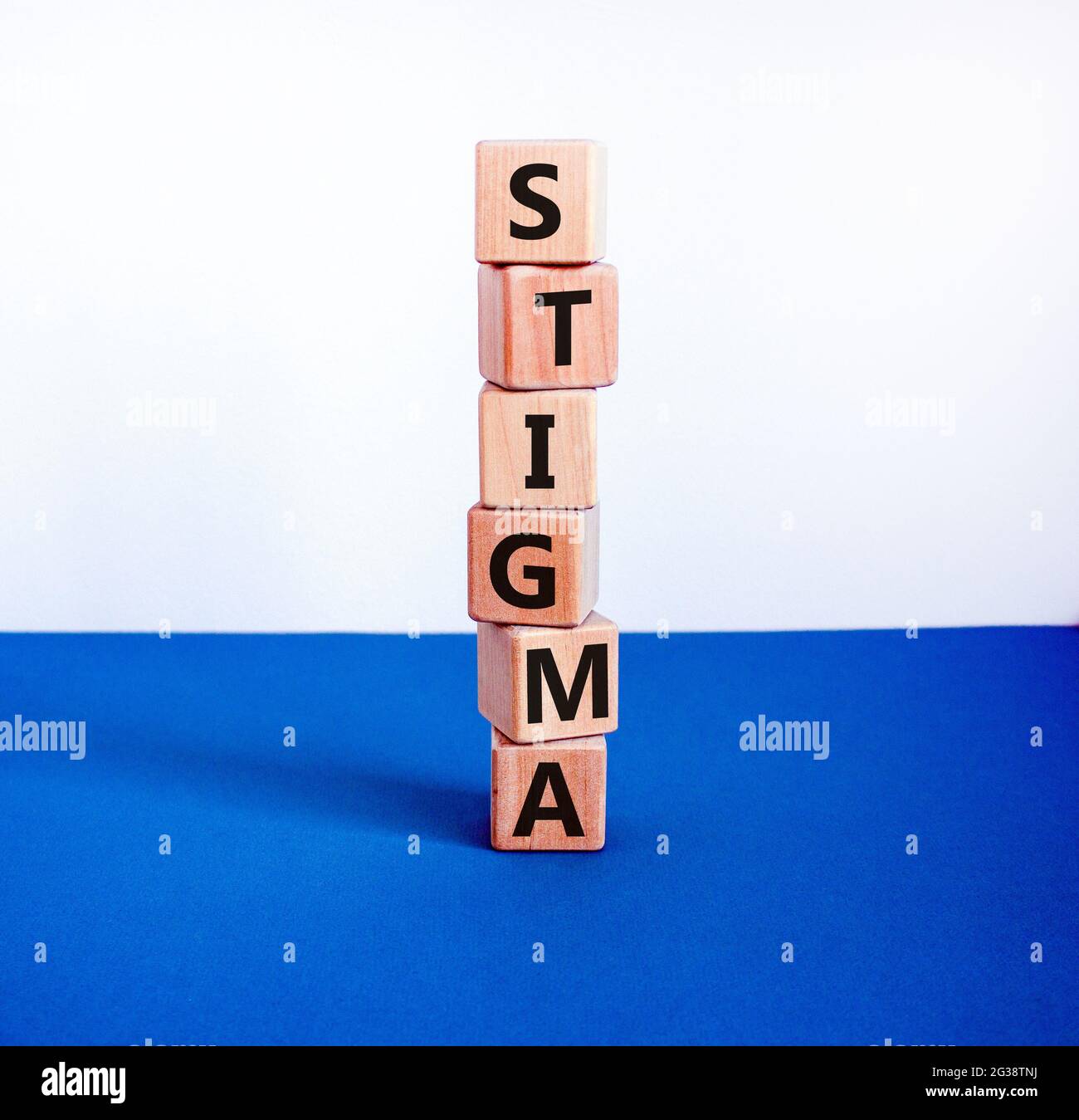 Stigma symbol. Wooden cubes with the word 'stigma'. Beautiful white and
