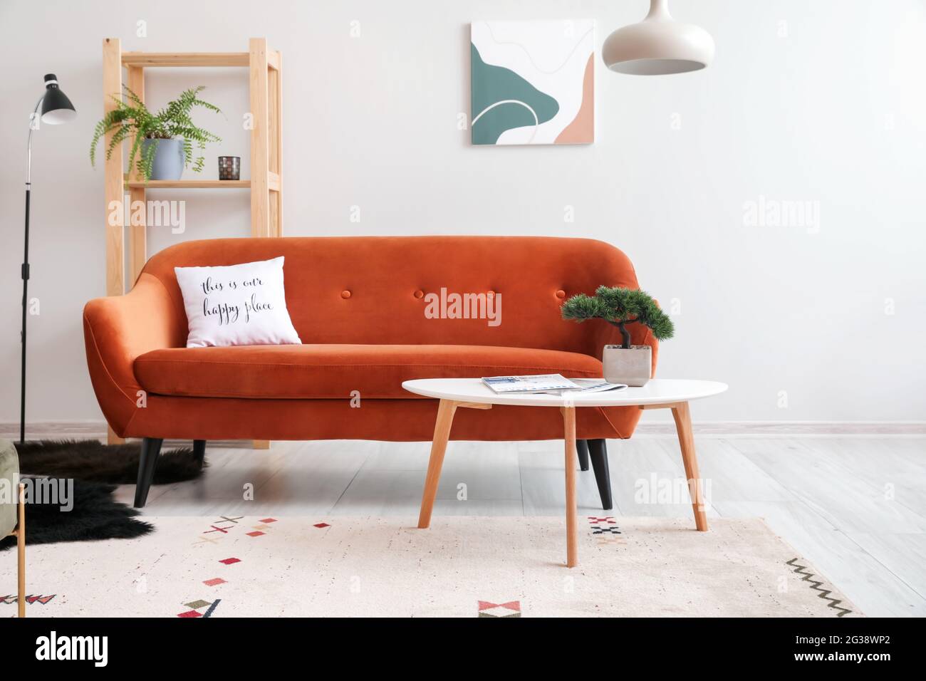 Interior of living room with stylish sofa Stock Photo - Alamy
