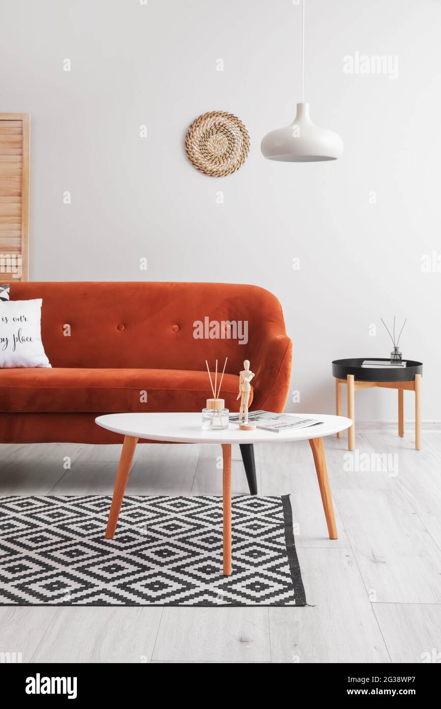 Interior of living room with stylish sofa Stock Photo - Alamy