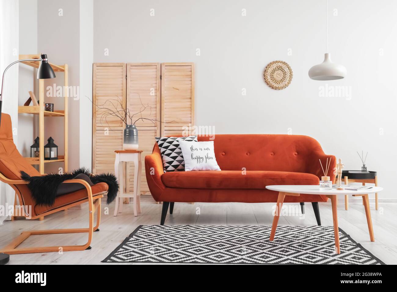 Interior of living room with stylish sofa Stock Photo - Alamy