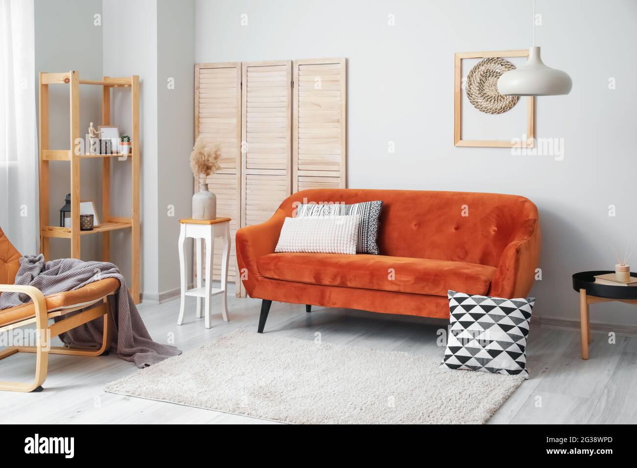 Interior of living room with stylish sofa Stock Photo - Alamy