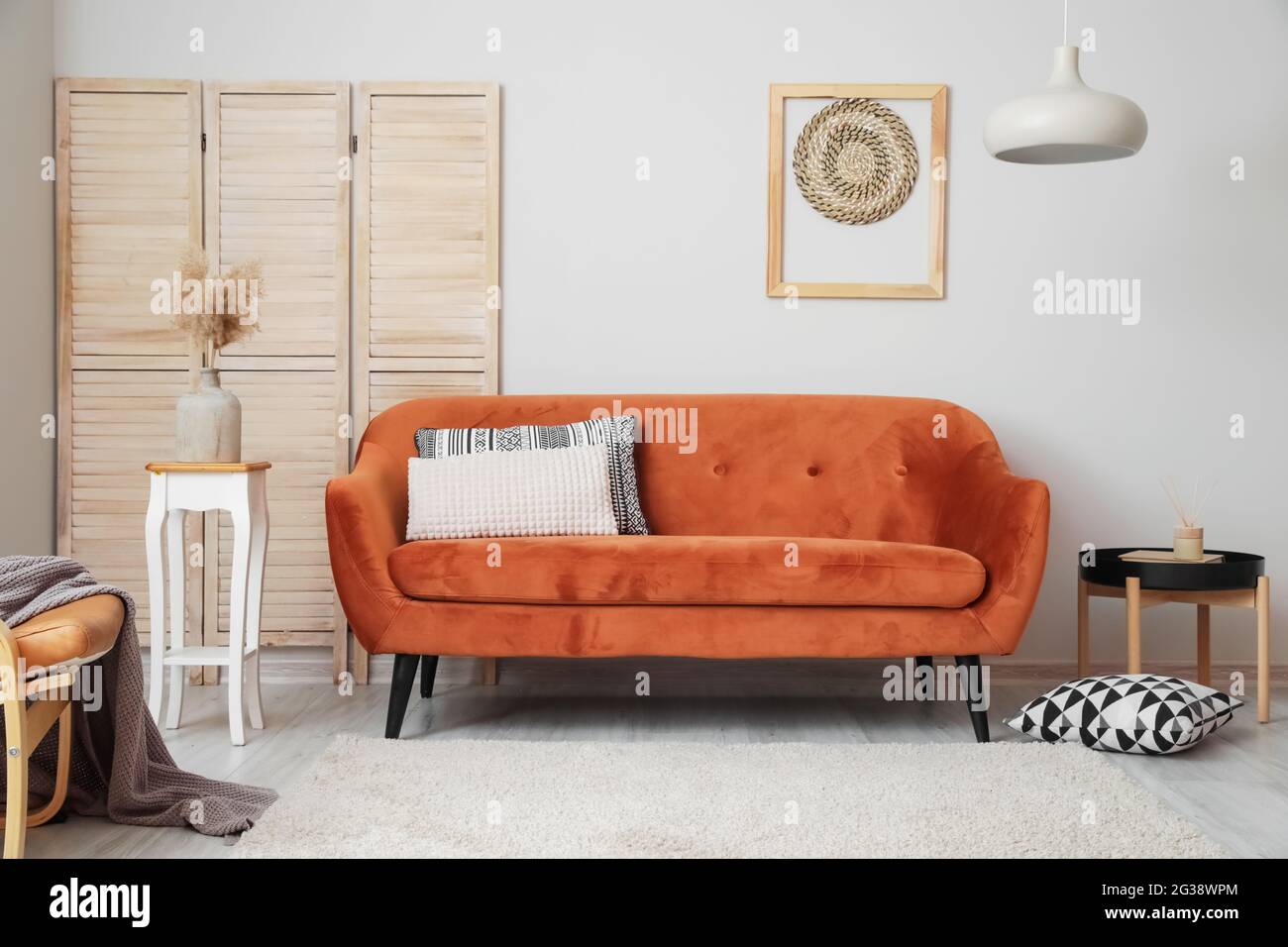 Interior of living room with stylish sofa Stock Photo - Alamy