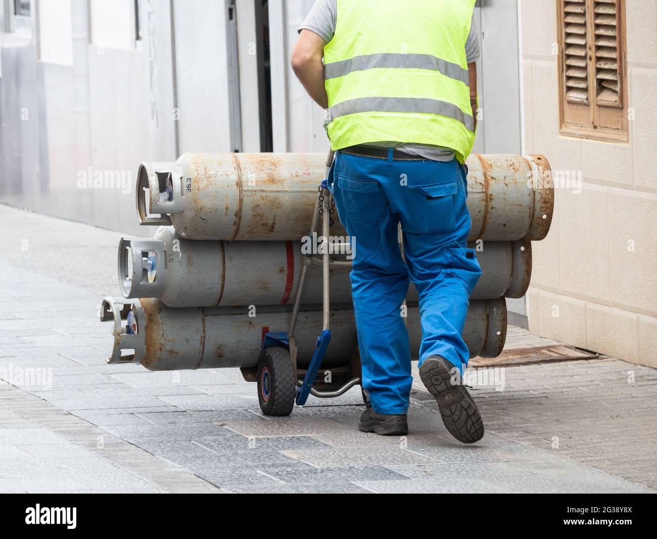 HGV driver delivering propane gas. Stock Photo