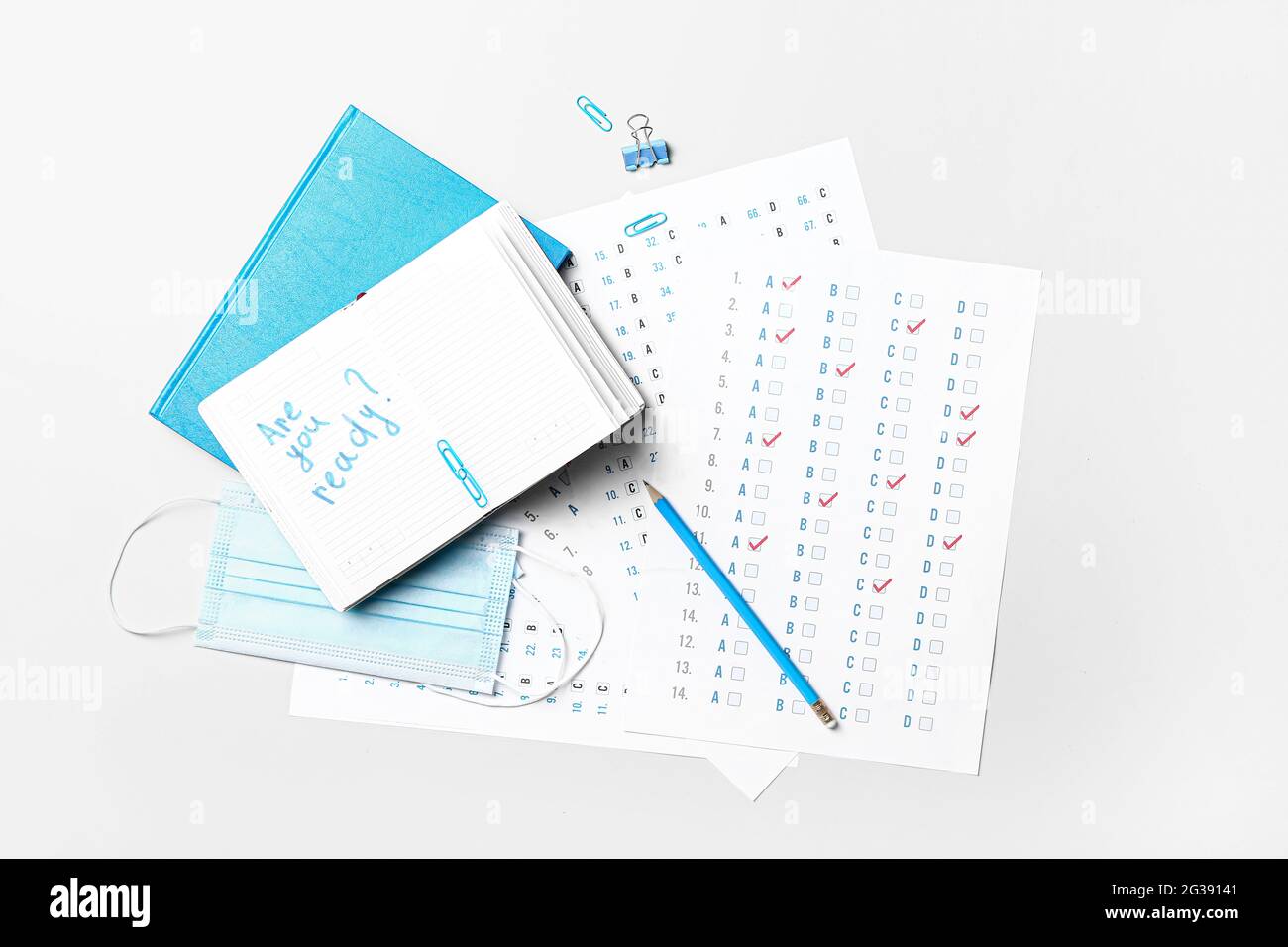 Stationery, answer sheet, mask and notebook with text ARE YOU READY? on ...