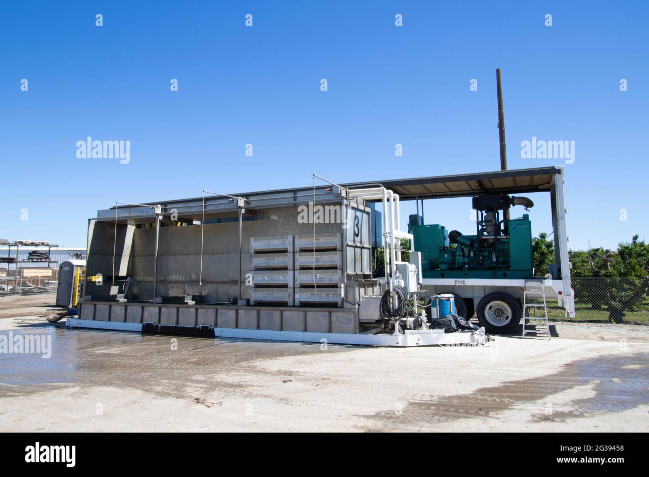 Morada Packing Company's mobile commercial cherry chiller onsite in San Benito County, California will cool field-picked cherry crop. Stock Photo