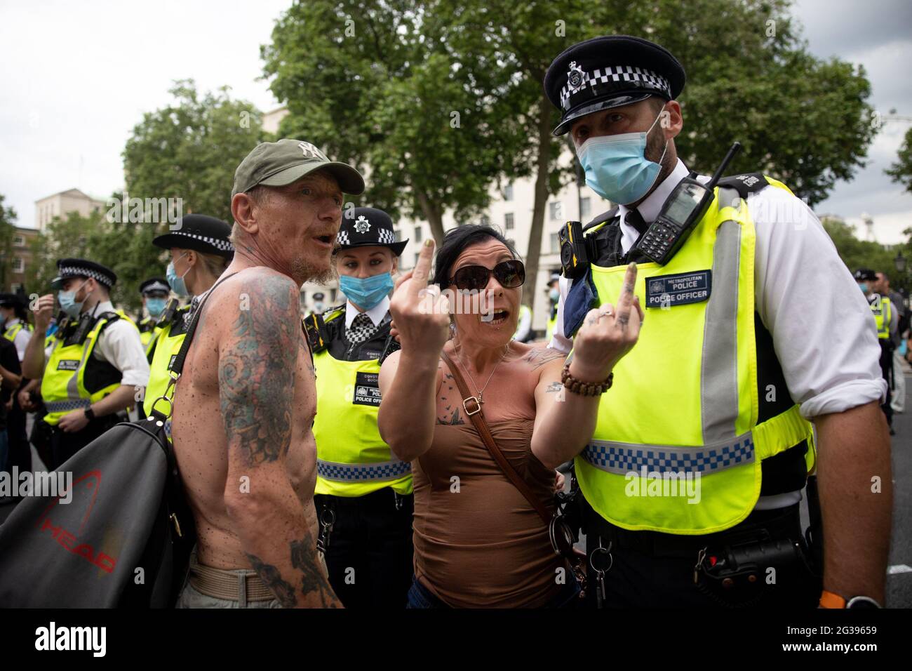 London, UK. 14th June 2021. Anti-vaxx protesters harass journalists. Yuen Ching Ng/Alamy Live News Stock Photo