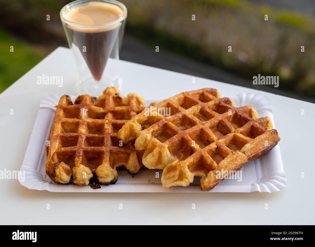 Belgian sugar waffles from Brussels with black coffee served outdoor Stock Photo