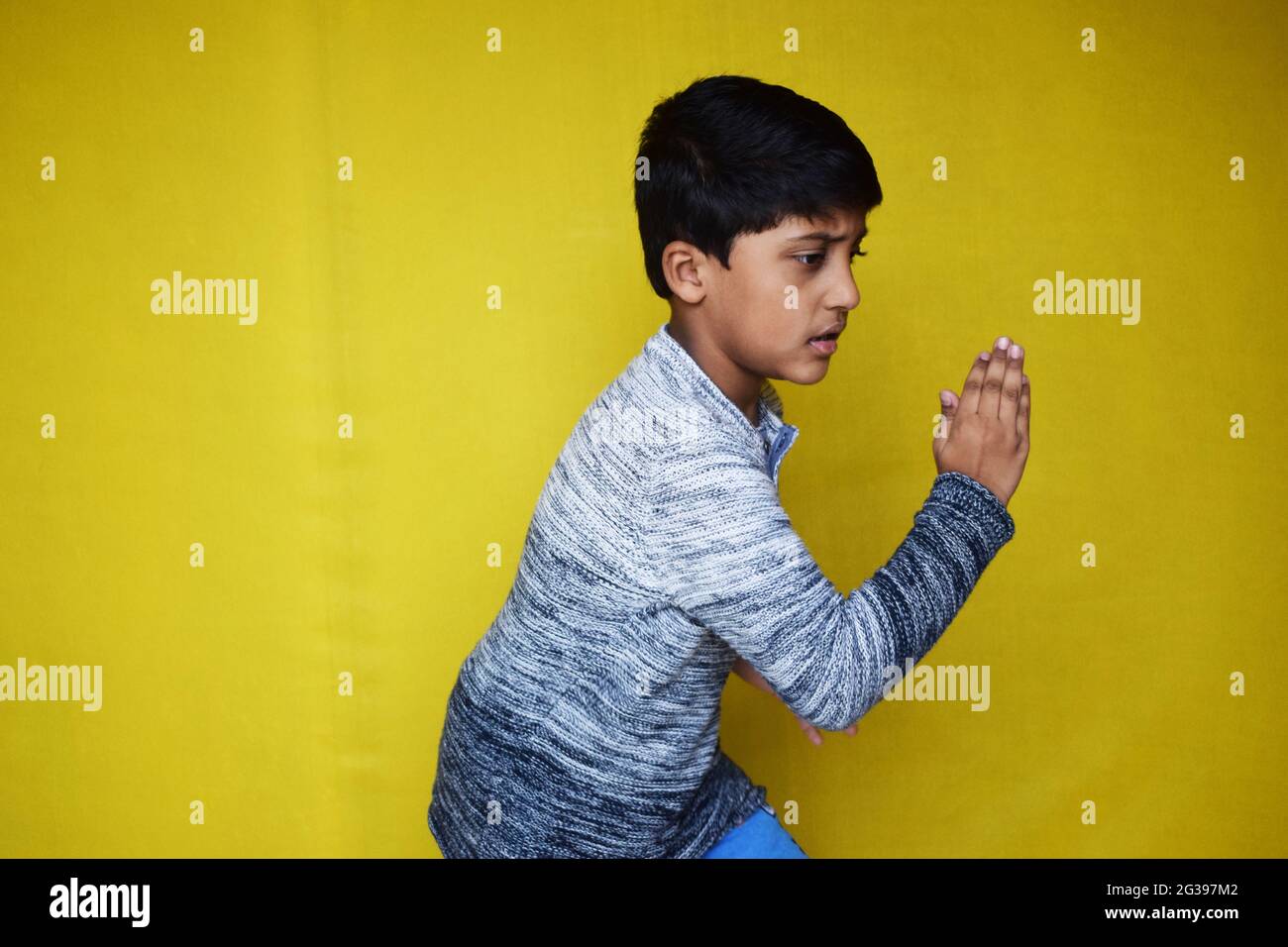 Funny Indian little boy pretending to run Stock Photo Alamy