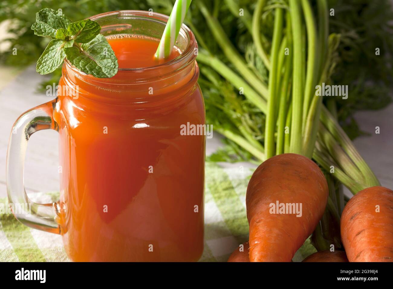 Delicious and healthy juice of young carrots. Orange drink. Carrot