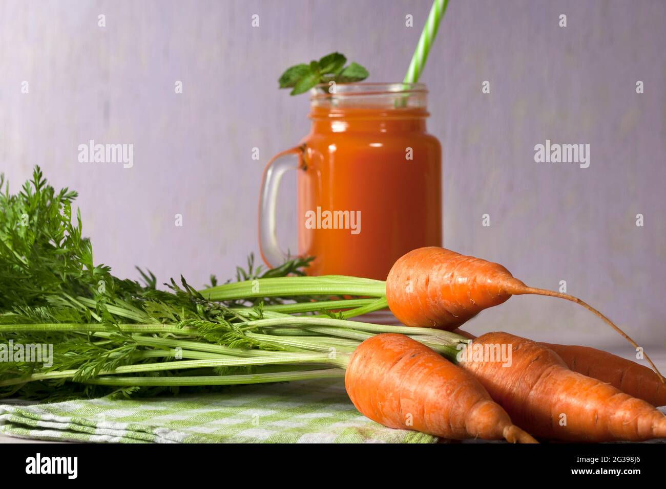 Delicious and healthy juice of young carrots. Orange drink. Carrot