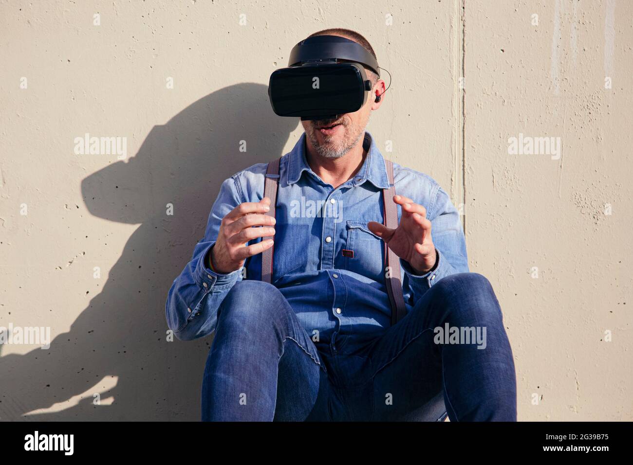 Happy man wearing VR glasses Stock Photo