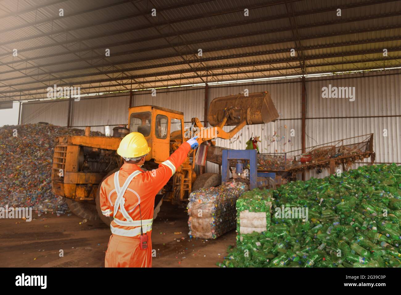 Recycling industry a worker who recycling thing on recycle center Stock