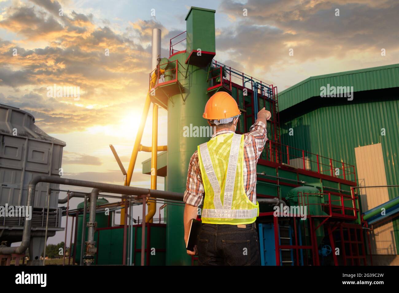 Engineers working in the power plant area Stock Photo