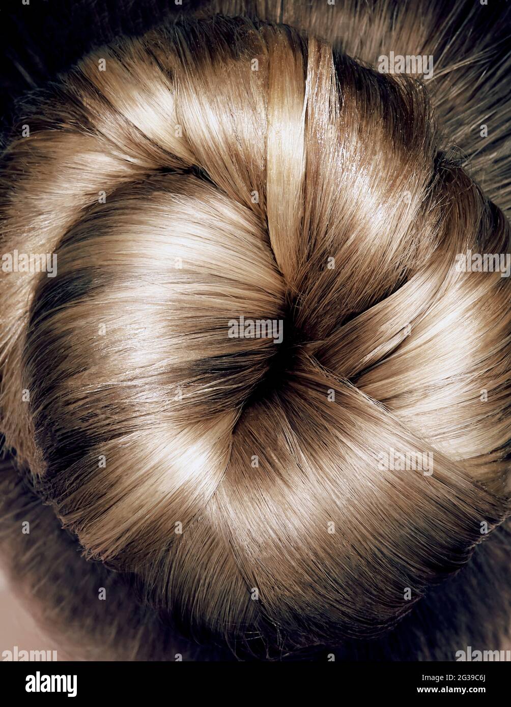 Close up topknotBeautiful fashionable hairstyle. Pretty woman back and head on white background Stock Photo