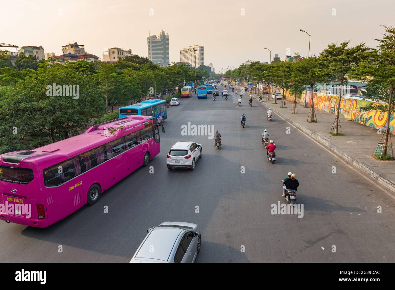 A busy unmarked road with cars buses and motocycles in Hanoi, Vietnam Stock Photo