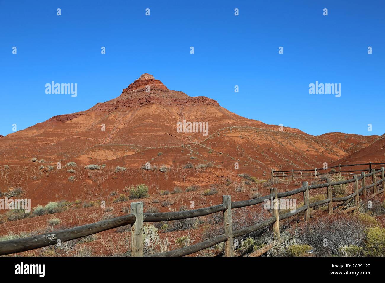 Wooden fence and red monument - Castle Valley - Utah Stock Photo