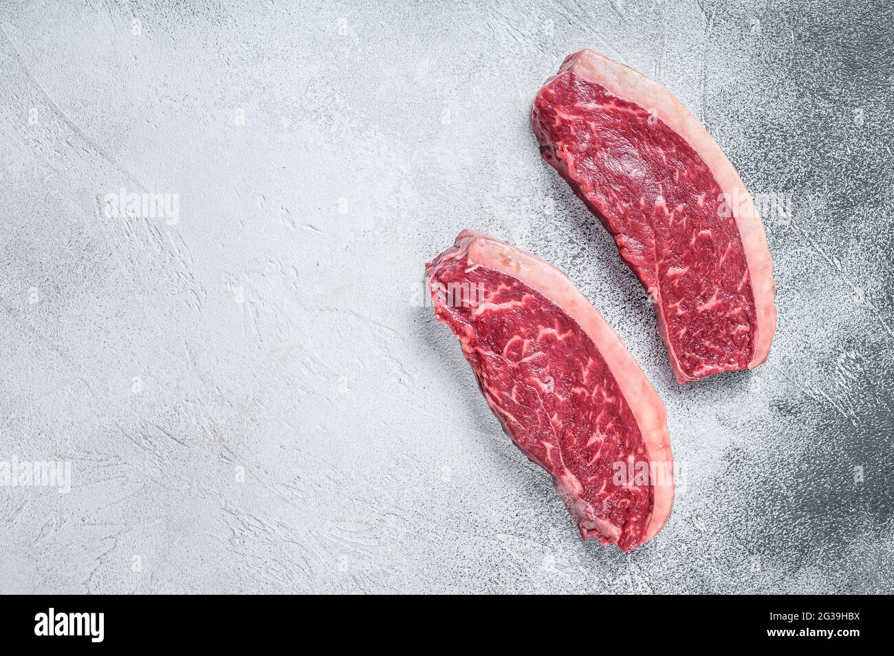 Shiro Kin Rump Cap Raw cap rump or top sirloin beef meat steak. White background. Top view ...