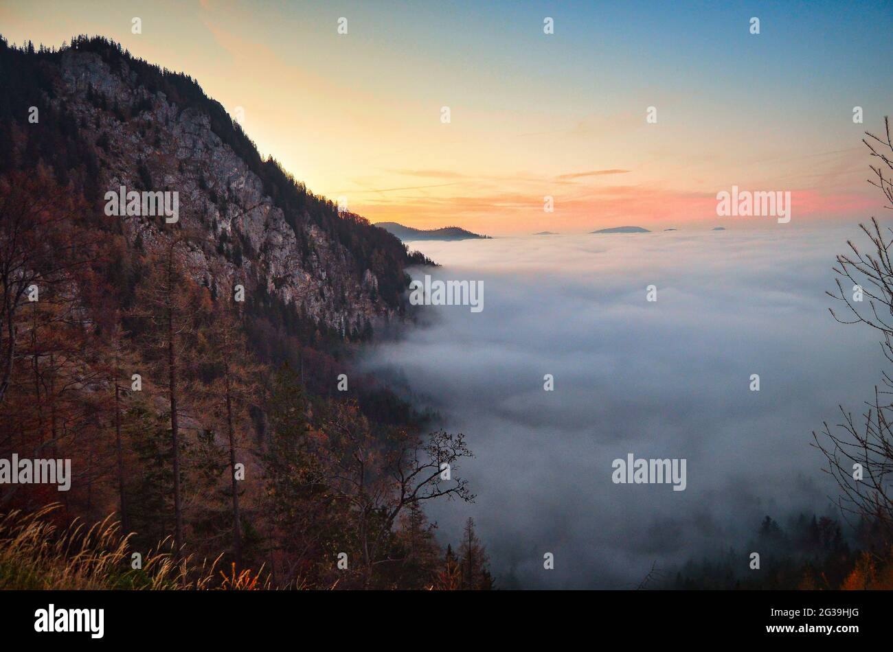 sunset on the mountain with view over a sea of clouds Stock Photo - Alamy