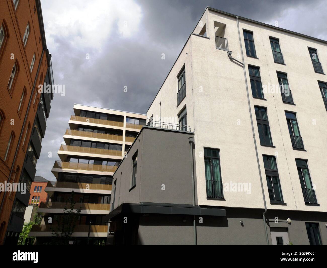 Low angle shot of urban buildings under a cloudy sky Stock Photo - Alamy