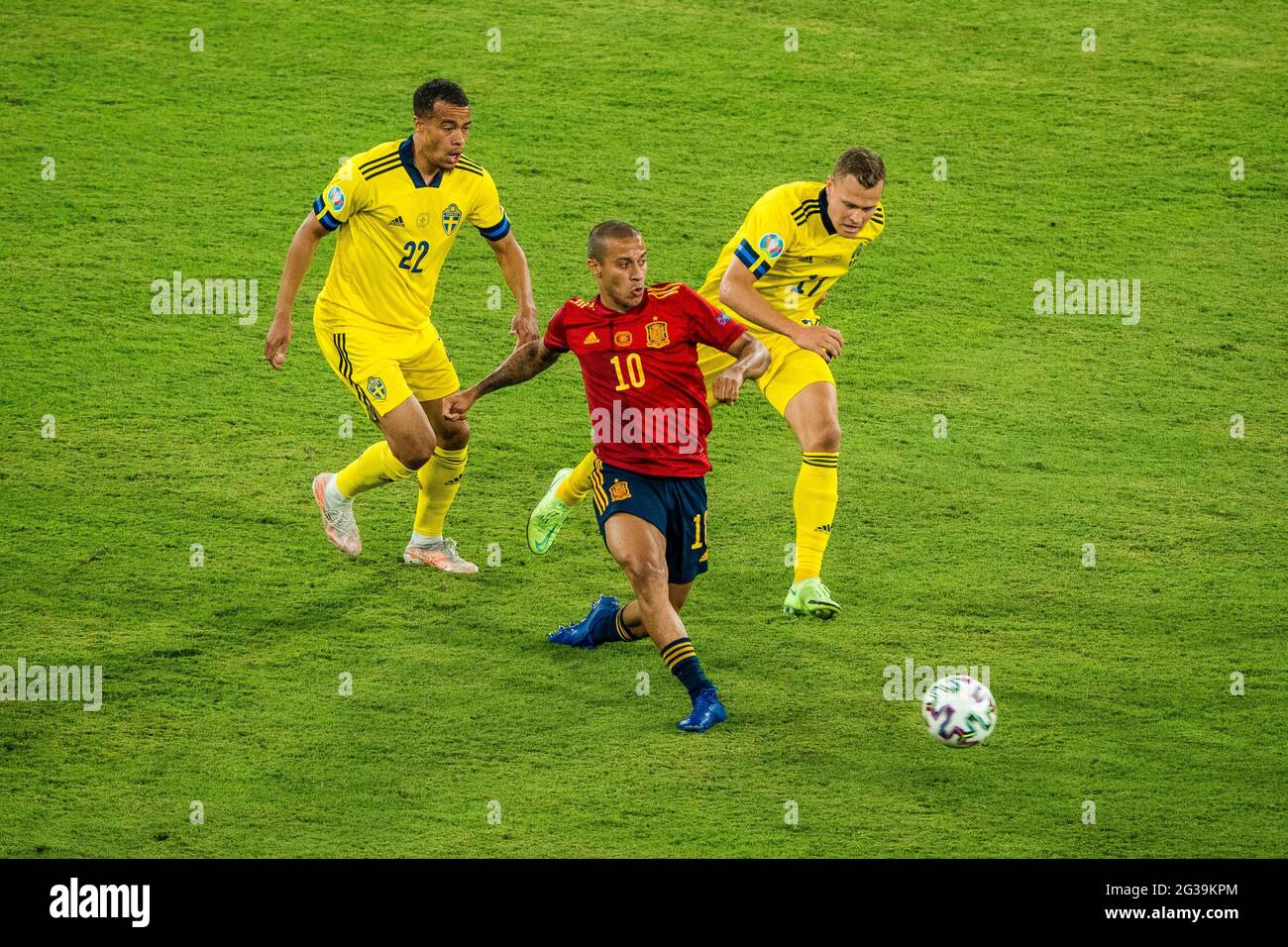 Seville, Spain. 14th June, 2021. Thiago Alcantara (C) of Spain vies with Robin Quaison (L) and Viktor Claesson of Sweden during the UEFA Euro 2020 Championship Group E match in Seville, Spain, June 14, 2021. Credit: Joan Gosa/Xinhua/Alamy Live News Stock Photo