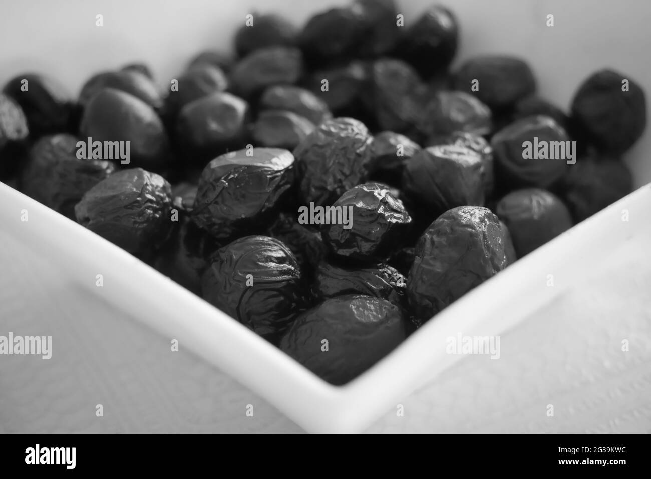 Grayscale shot of black olives Stock Photo Alamy