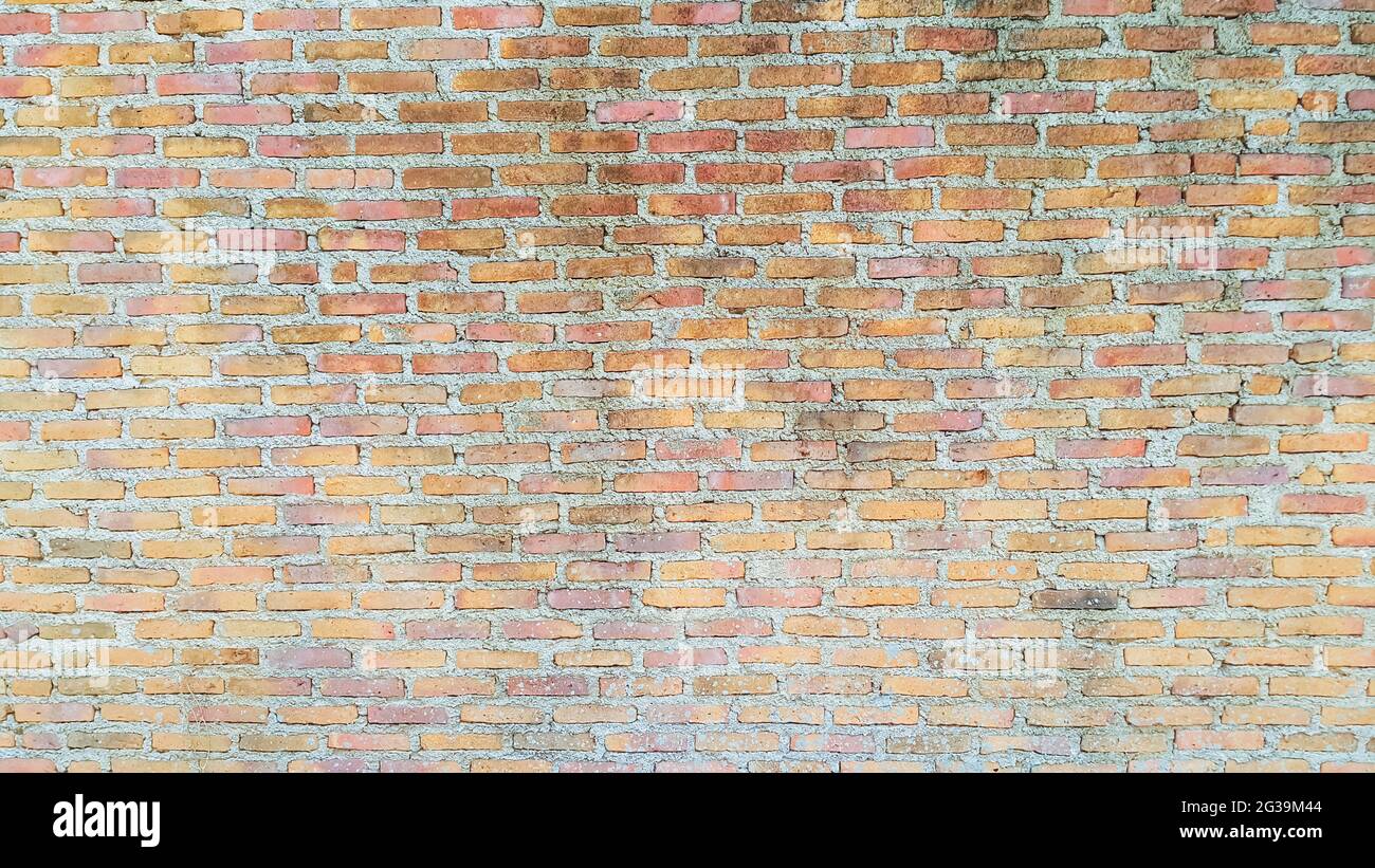 old orange vintage brick wall background Stock Photo - Alamy