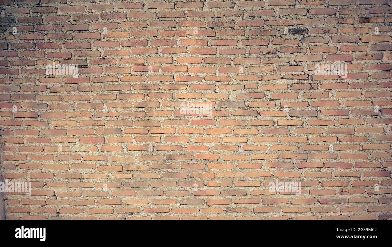 old orange vintage brick wall background Stock Photo - Alamy