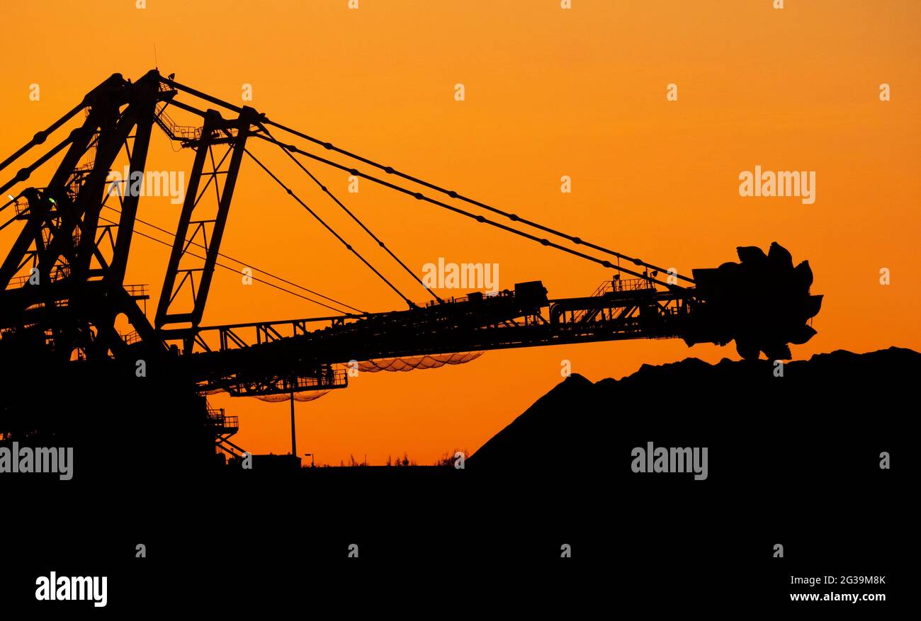 Sunset over Iron Ore mining machinery in Port Hedland Western Australia. Stock Photo
