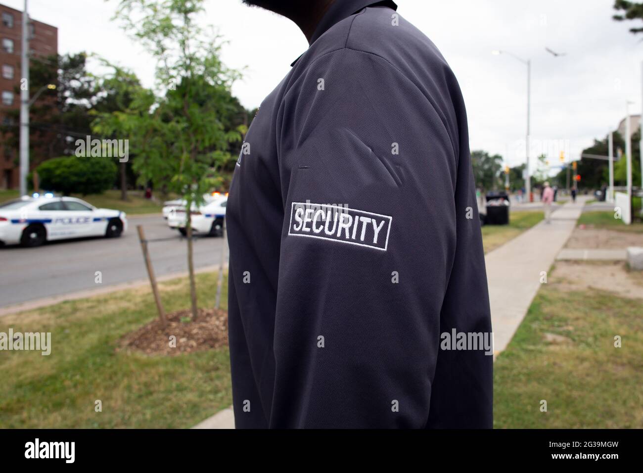 Security guard in uniform patrolling a residential area Stock Photo - Alamy