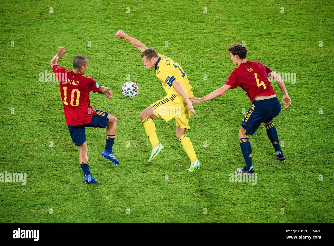Seville, Spain. 14th June, 2021. Pau Torres (R) and Thiago Alcantara (L) of Spain compete with Viktor Claesson of Sweden during the UEFA Euro 2020 Championship Group E match in Seville, Spain, June 14, 2021. Credit: Joan Gosa/Xinhua/Alamy Live News Stock Photo