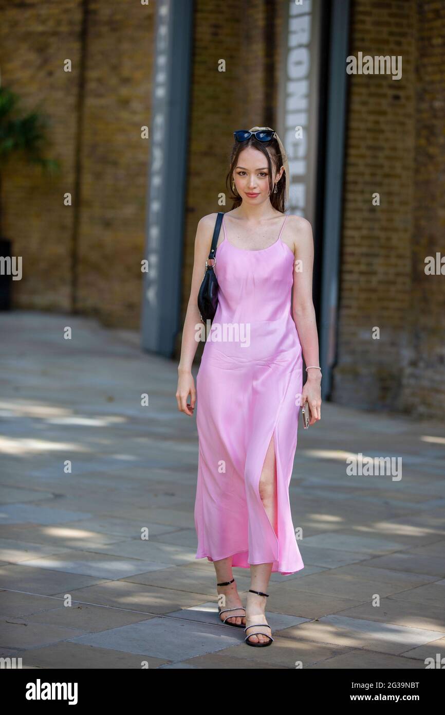 London, UK. 14th June, 2021. A lady wears a Pink Zara dress during the  London Fashion Week digital shows in London. (Photo by Pietro Recchia/SOPA  Images/Sipa USA) Credit: Sipa USA/Alamy Live News