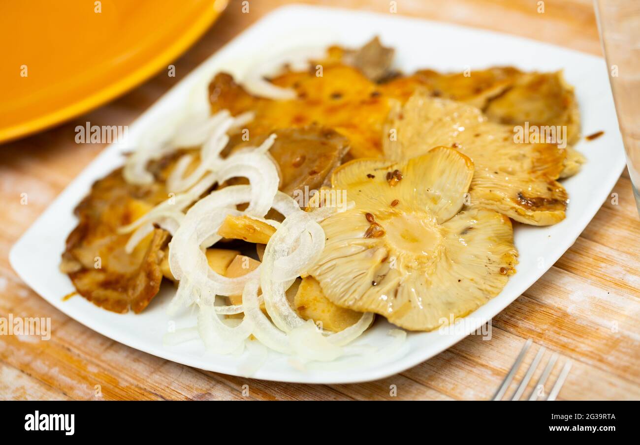 Pickled russula delica with onions Stock Photo