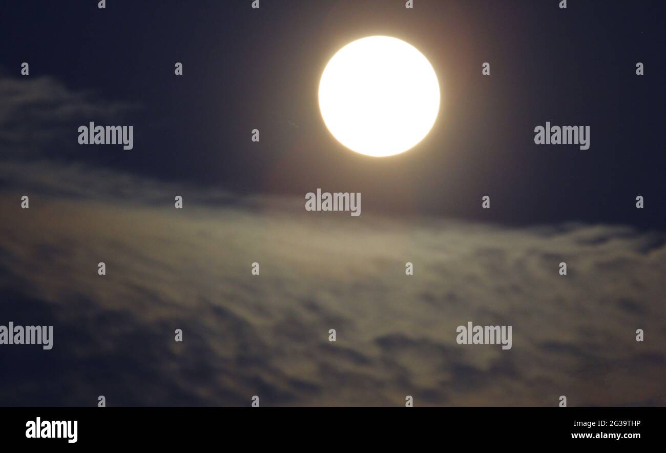 Beautiful bright full moon on a black sky background Stock Photo - Alamy