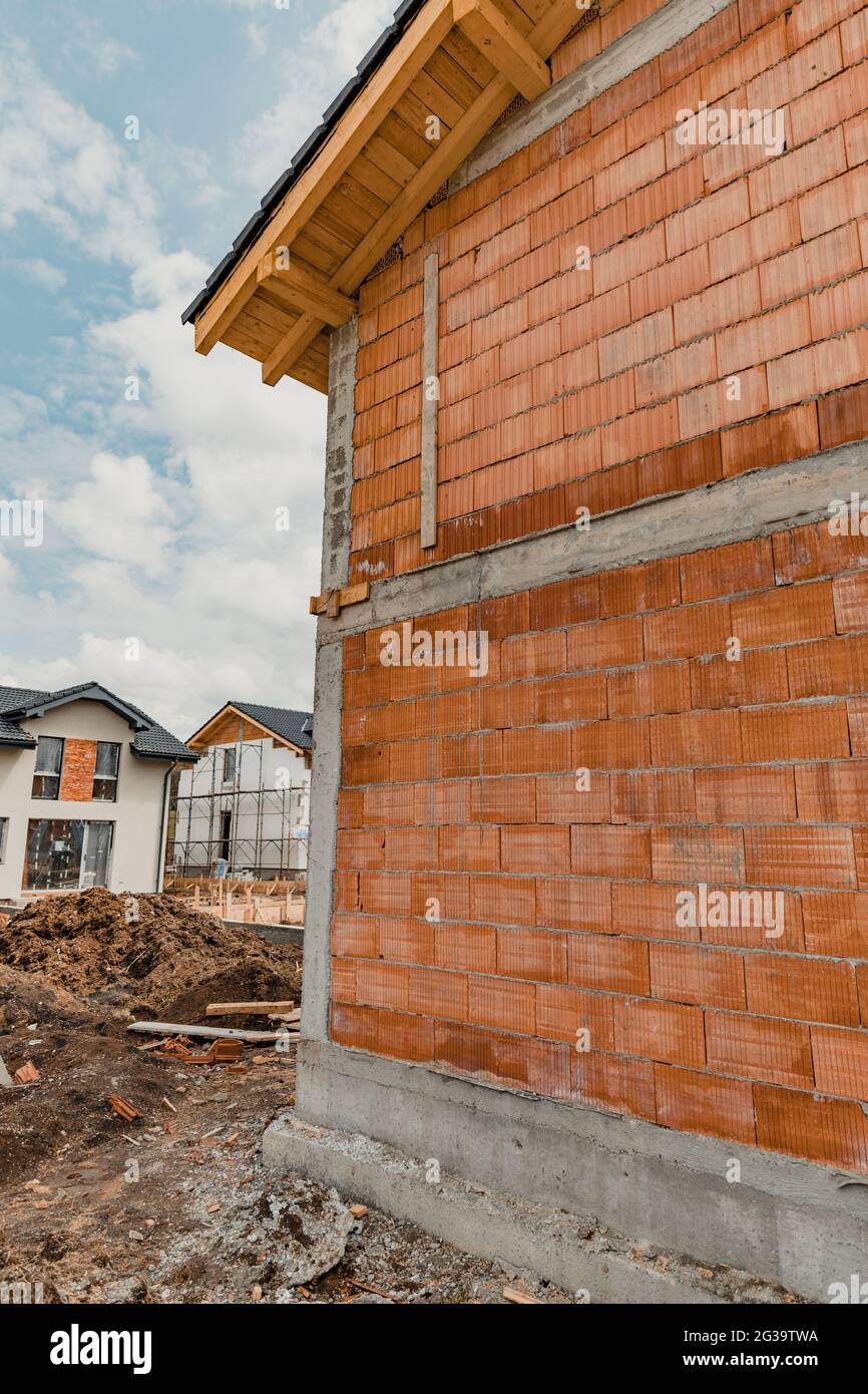 Vertical shot of the newly built houses under a cloudy sky ...