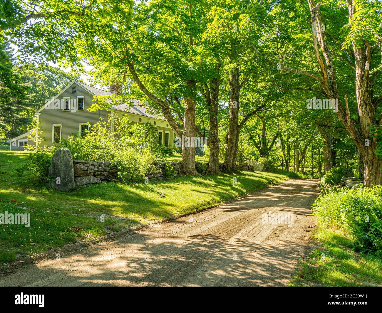 An old house on a dirt road in Petersham, Massachusetts Stock Photo