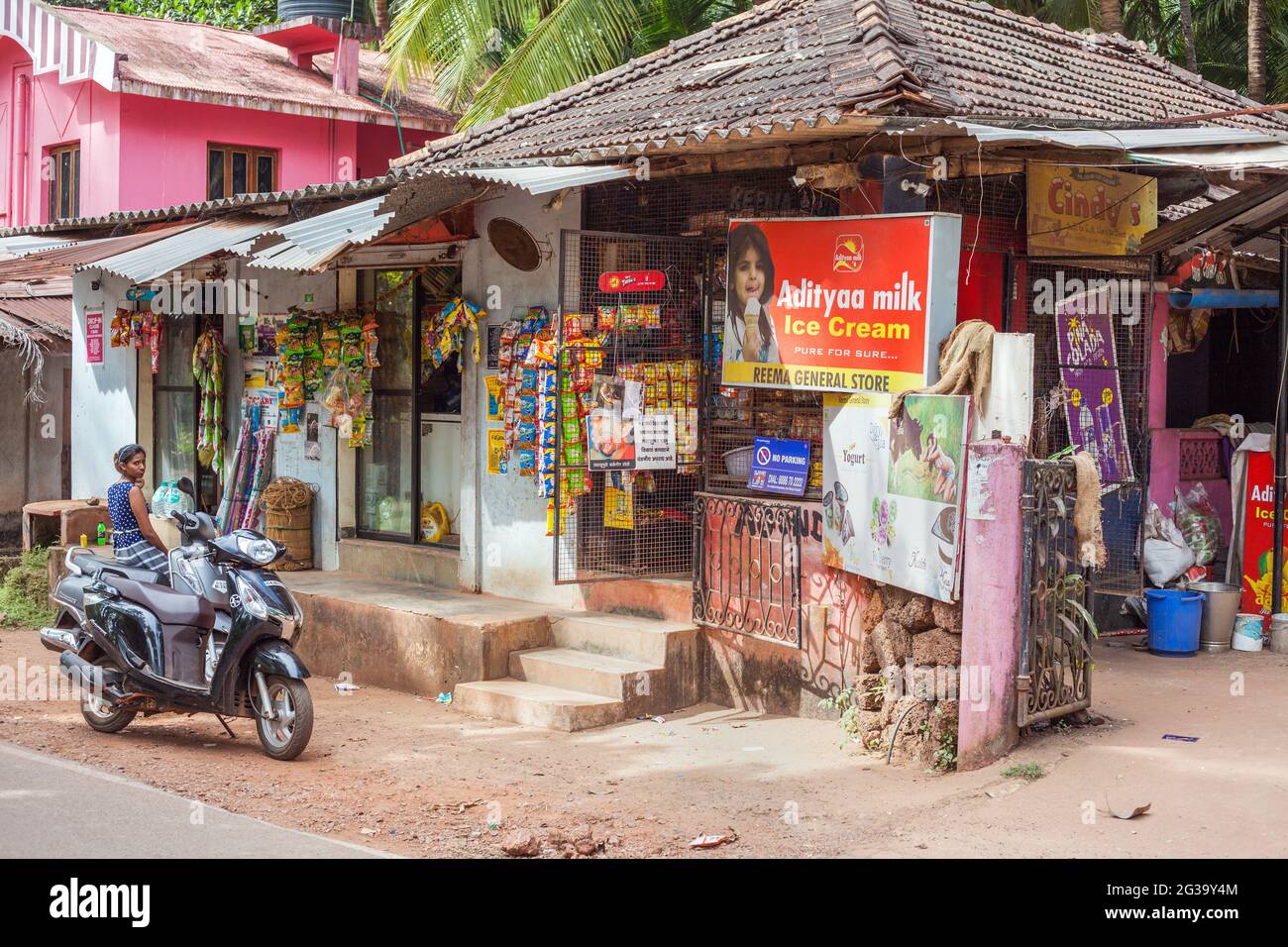 Advertising and goods for sale outside Reema General Store, Agonda, Goa, India Stock Photo