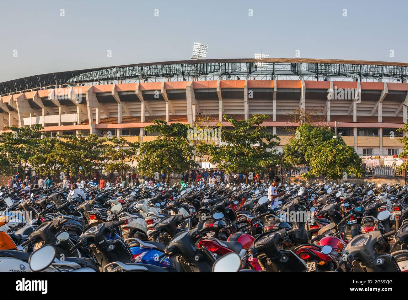 Motorbikes and scooters parked outside the Fatorda football Stadium (Jawaharial Nehru Stadium), home to Goa FC, Margao, Goa, India Stock Photo