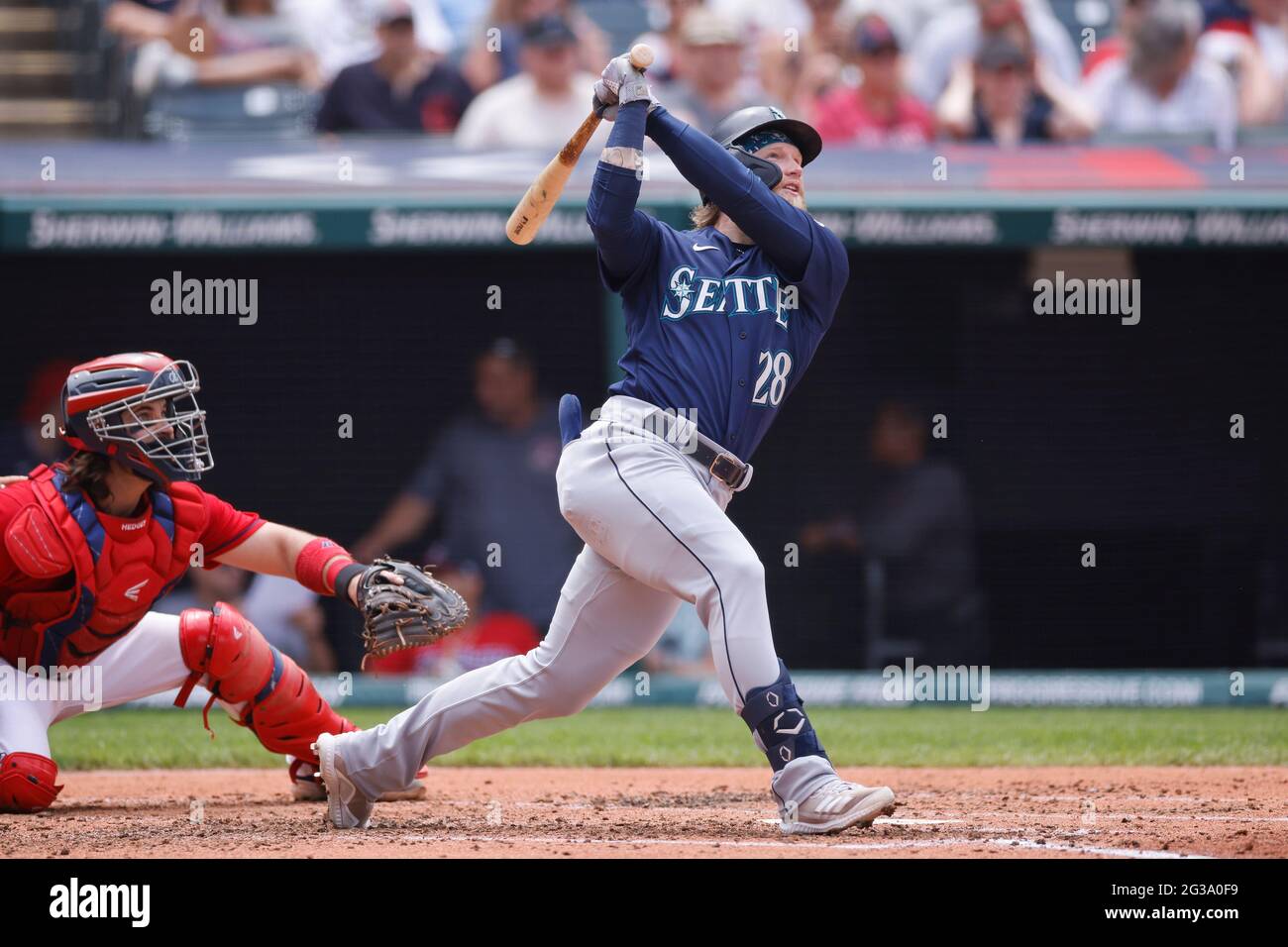 CLEVELAND, OH - JUNE 13: Jake Fraley (28) of the Seattle Mariners hits a two-run home run in the fourth inning of a game against the Cleveland Indians Stock Photo