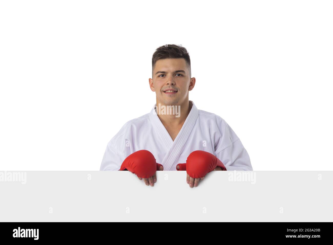 Man fighter training taekwondo with blank banner isolated on white  background Stock Photo - Alamy