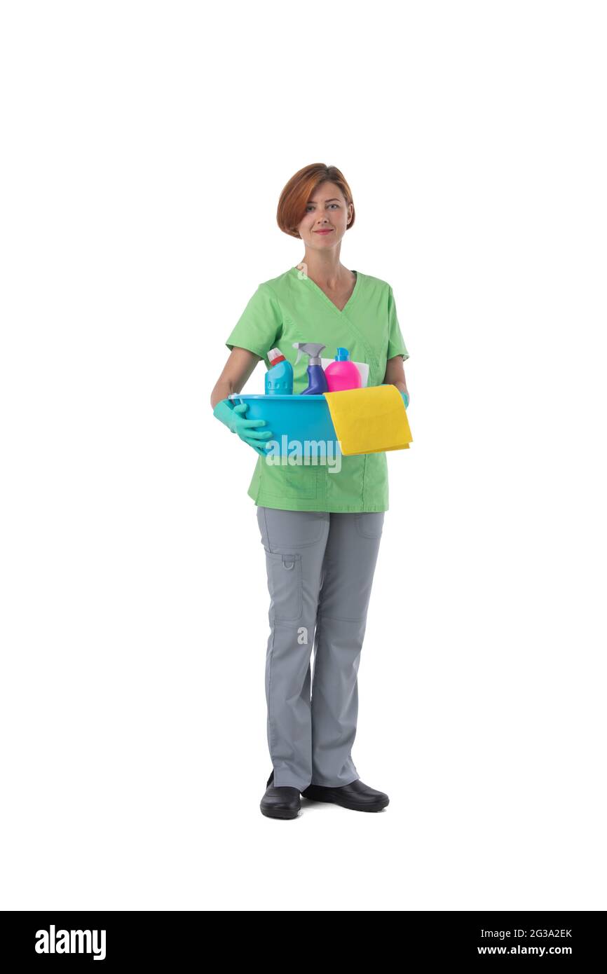 Cleaner woman with detergent spray container isolated on white background, full length portrait Stock Photo