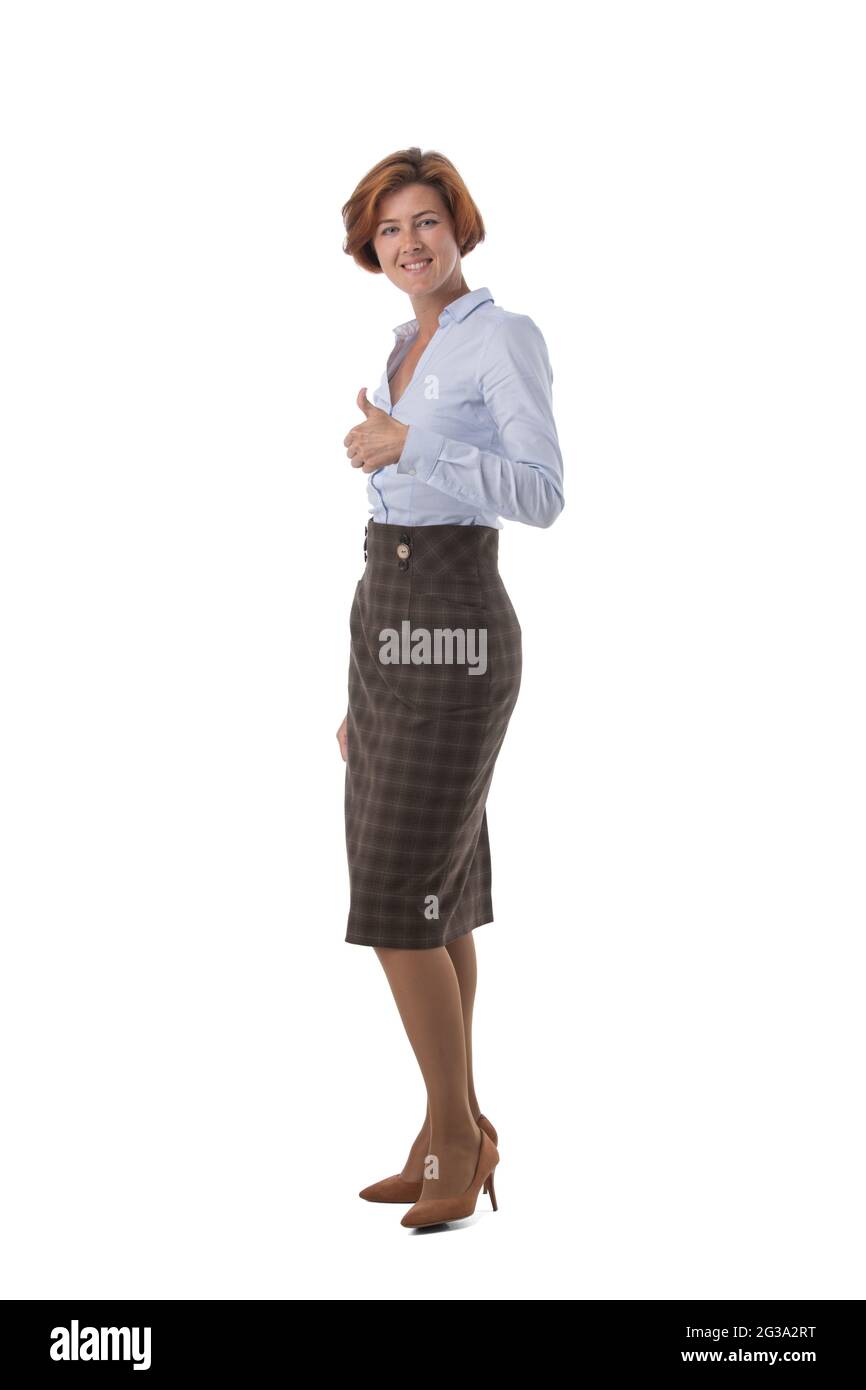 Full length portrait of young business woman with thumb up studio ...