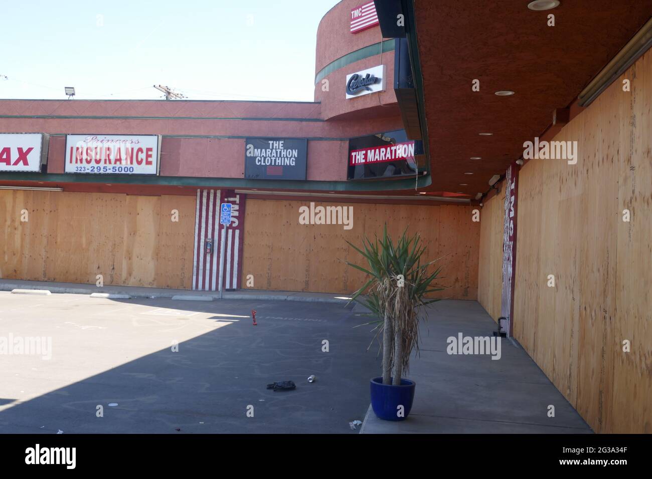 Los Angeles, California, USA 14th June 2021 A general view of atmosphere of Rapper Nipsey Hussle's The Marathon Clothing Store where he was murdered March 31, 2019, now boarded up closed with Street Art Memorial Murals on June 14, 2021 in Los Angeles, California, USA. Photo by Barry King/Alamy Stock Photo Stock Photo