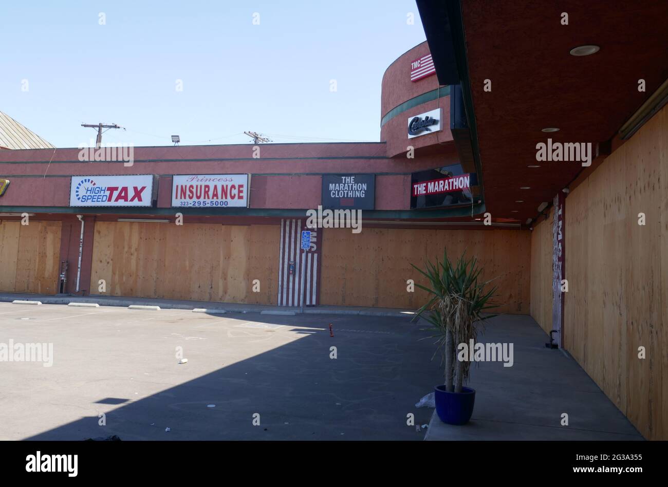 Los Angeles, California, USA 14th June 2021 A general view of atmosphere of Rapper Nipsey Hussle's The Marathon Clothing Store where he was murdered March 31, 2019, now boarded up closed with Street Art Memorial Murals on June 14, 2021 in Los Angeles, California, USA. Photo by Barry King/Alamy Stock Photo Stock Photo