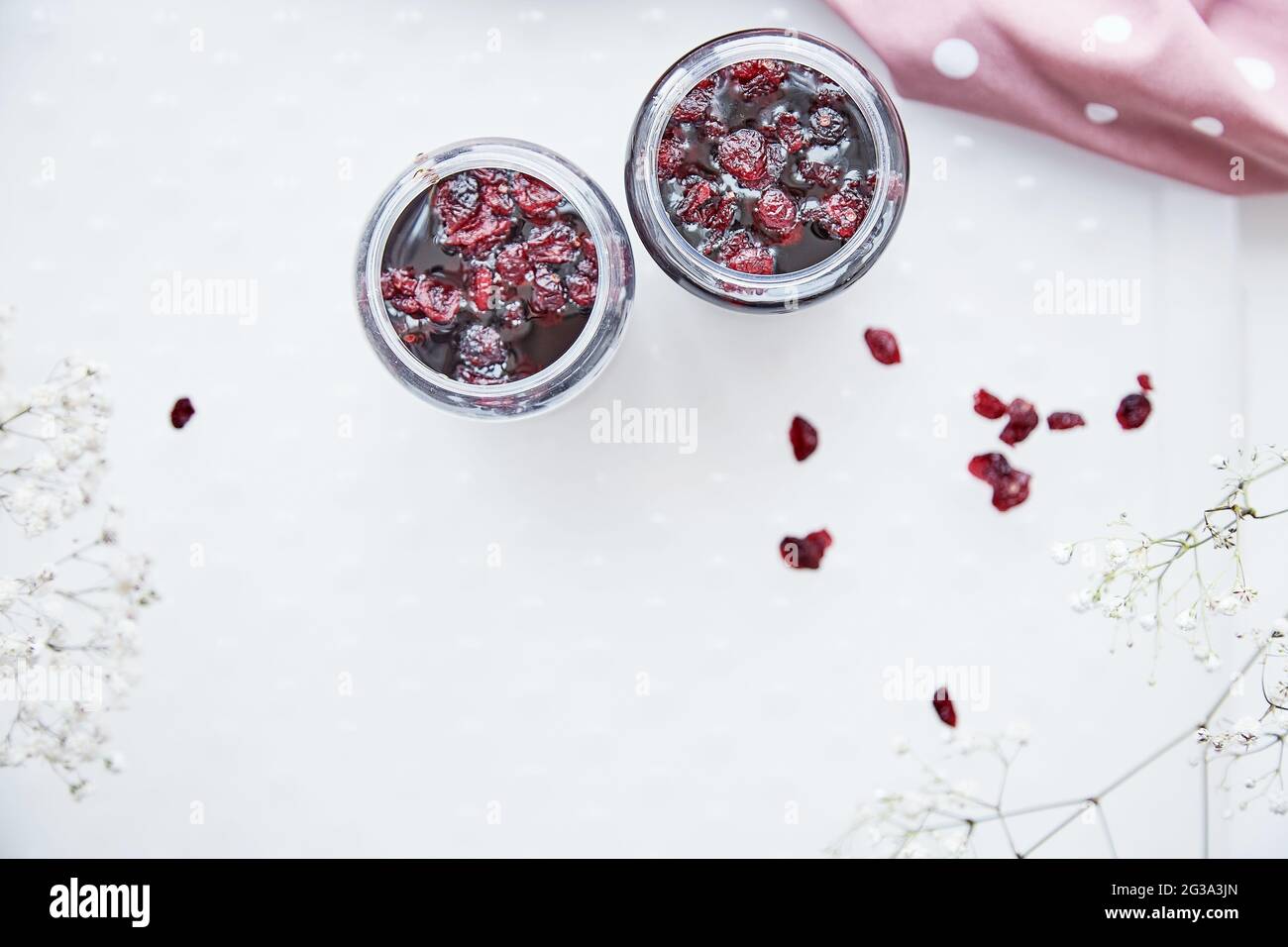 Healthy fermented honey product with cranberry. Food preservative at home, cozy, rustic flat lay. Delicious recipe concept. Anti-viral food. anti-bacterial, anti-viral product. Top view with copy Stock Photo
