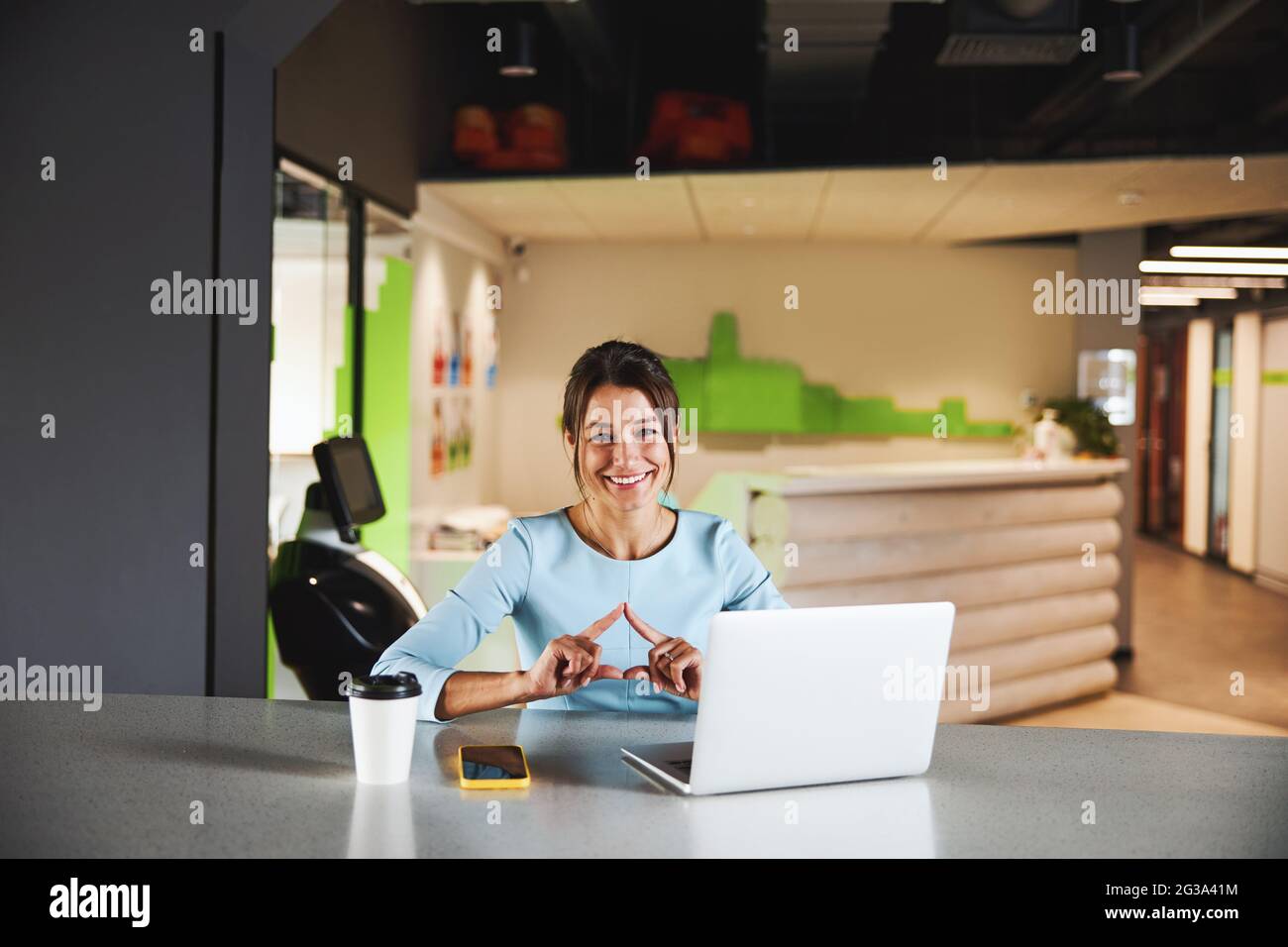 Beautiful elegant office worker gesturing and looking at the photo ...