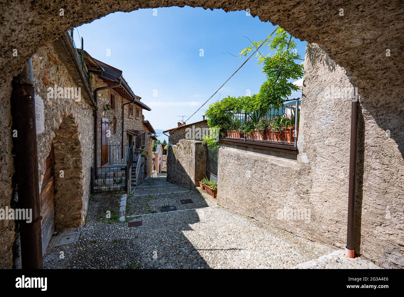 Gardola, Italy. 14th June, 2021. A small alley in the old part of the town. Credit: Daniel Reinhardt/dpa/Alamy Live News Stock Photo