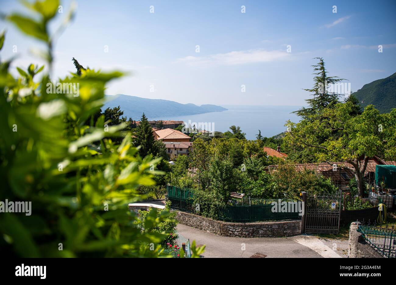 Gardola, Italy. 14th June, 2021. View from the village over Lake Garda. Credit: Daniel Reinhardt/dpa/Alamy Live News Stock Photo